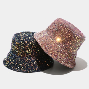 Sparkly sequin bucket hat in navy and pink showing reflective material and trendy style