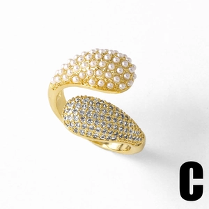 Close-up of 18k gold-plated open ring featuring clustered white pearls and zircon details