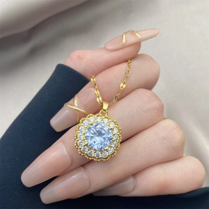 Collier vintage avec pendentif en zircon, grand cristal rond et motif floral doré