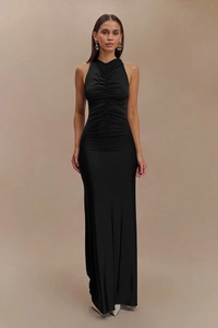Detail of elegant black sleeveless maxi dress featuring pleated drawstring front design