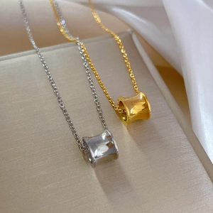 Gold and silver cylinder pendant necklaces in titanium steel with polished O-chains