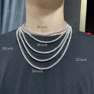 Layered display of 4mm silver tennis necklaces in sizes 16 to 24 inches on a model