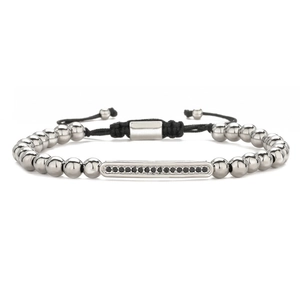 Detail of beaded bracelet with black zircon inlays and adjustable woven rope closure