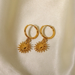 Vintage 18K gold-plated titanium steel hoop earrings featuring sun face pendants on silk