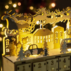 Wooden Christmas advent calendar featuring 24 drawers and laser-cut Santa sleigh scene