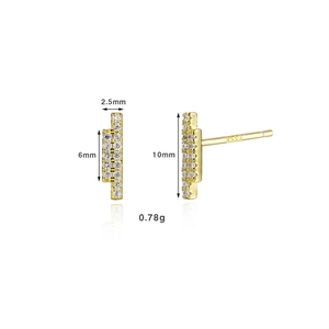 Macro shot of 18K gold S925 silver stud earrings with sparkling pavé zircons
