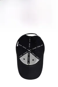 Close-up of baseball cap interior with white KYMY branded tape and breathable mesh lining