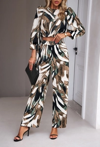 Detail of two-piece leisure set featuring abstract print high-waist wide-leg trousers