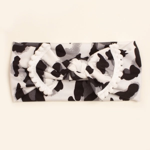Baby headband with leopard print and pom-pom trim in soft white and grey fabric