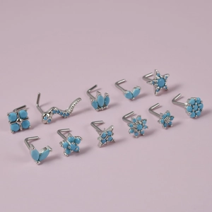 Set of 11 turquoise nose studs in silver L-shape with flower and crown designs