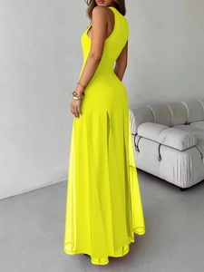 Detail of elegant yellow sleeveless maxi dress with sheer tulle slit and inner lining