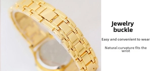 Detail of gold metal watch band with jewelry clasp and polished rectangular chain links