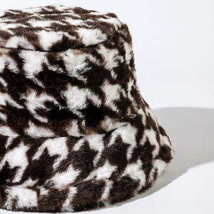 Brown houndstooth plush bucket hat made of soft faux fur for winter warmth