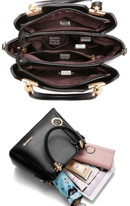 Detailed interior view of a black pebbled leather tote showing multi-compartment storage