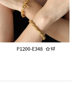 Close-up of golden twisted rope chain bracelet on wrist with elegant polished texture