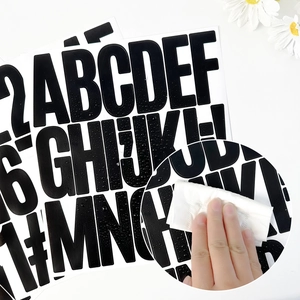 Detail showing waterproof test on 3-inch black vinyl letter and number stickers