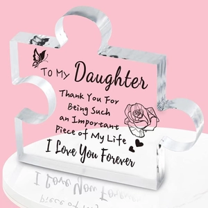 Acrylic puzzle piece keepsake with heartfelt message to daughter on pink background