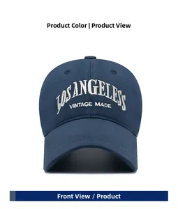 Close-up of Los Angeles vintage embroidery on navy blue cotton twill baseball cap