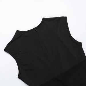 Detail of the hidden back zipper on a black sleeveless mesh jumpsuit for women