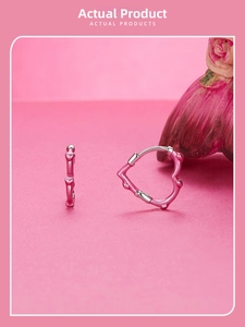 Close-up of pink heart hoop earrings in S925 sterling silver with enamel finish