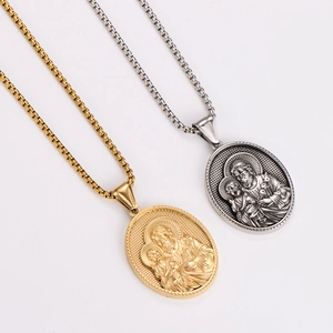 Oval stainless steel religious necklaces in gold and silver showing Joseph holding baby Jesus