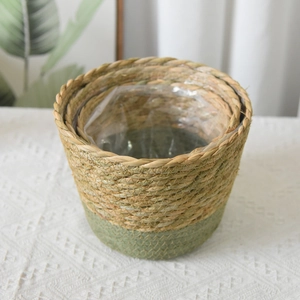 Close-up of seagrass basket with waterproof liner and natural green woven details