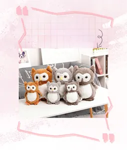 Detailed view of plush owl toys in brown and gray colors with soft faux rabbit fur texture