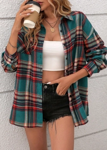 Front view of a red and green plaid shirt styled with a white top and denim shorts