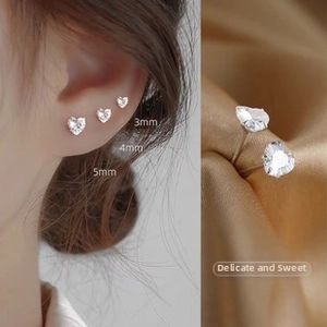 Macro shot of S999 sterling silver heart-shaped stud earrings in 3mm, 4mm, 5mm sizes