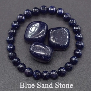 Macro shot of 8mm Blue Sand Stone beaded bracelet with polished natural ore stones
