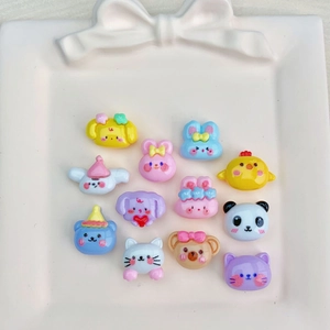 Close-up of colorful resin animal charms like panda and rabbit for DIY crafts