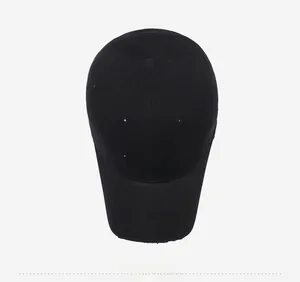 Top down macro view of distressed black cotton baseball cap with white FBHS embroidery