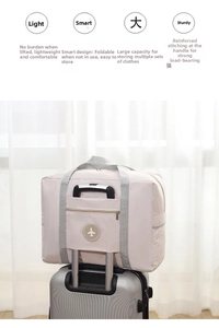 Detail of beige travel bag sleeve with airplane label fixed on silver luggage handle