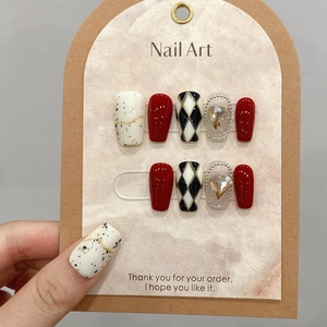 Handmade press-on nails in burgundy and diamond grid patterns with heart rhinestones