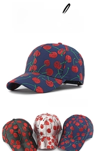 Detailed view of jacquard baseball caps featuring red cherry patterns in various colors