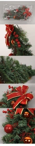 Close-up of PVC Christmas swag with red bows, gold baubles and festive pine texture