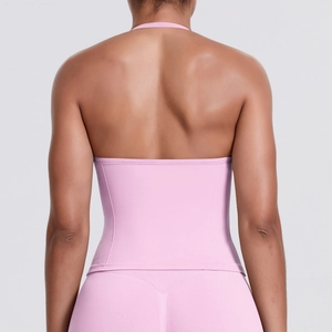 Close-up of the seamless racerback design on a pink compression sports bra and yoga top