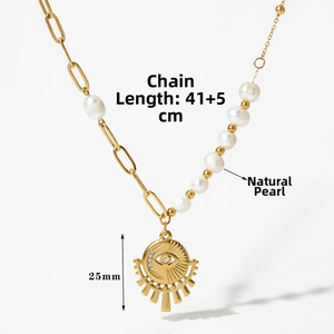 Detail of asymmetric pearl necklace with evil eye pendant measuring 25mm in diameter