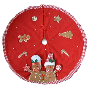 Red Christmas tree skirt with plush gingerbread man, candy cane and pom-pom decorations