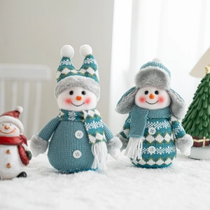 Christmas snowman plush set with blue knitted outfits and miniature festive trees