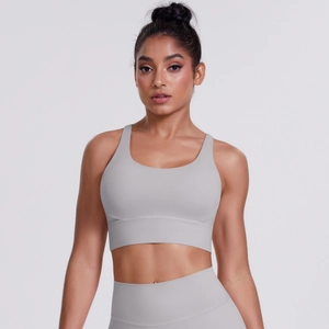 Close-up of light grey brushed yoga bra featuring a deep U-neck and wide shoulder straps