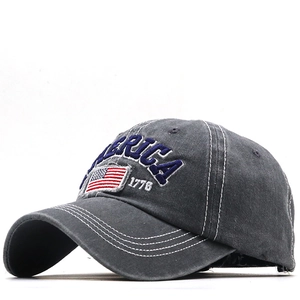 Macro detail of 1776 AMERICA 3D embroidery on vintage washed grey baseball cap