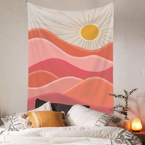 Bohemian sun and mountain tapestry hanging in a cozy minimalist bedroom setup