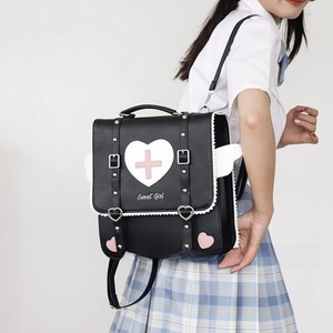 Detailed view of the Sweet Girl heart pattern design on a black JK style backpack