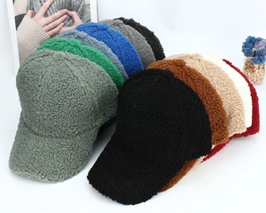 Stack of fleece baseball caps in multiple colors showing thick warm autumn texture