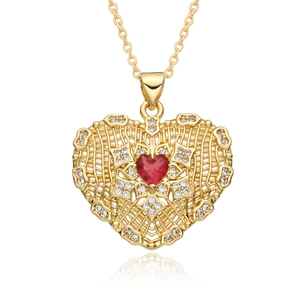 Close-up of heart-shaped gold necklace featuring red gemstone and white zircon detail