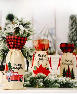 Three Christmas burlap wine bottle covers with plaid patterns and festive prints