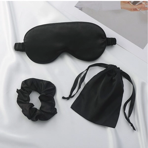 Three-piece black satin sleep set with eye mask, scrunchie and drawstring storage bag