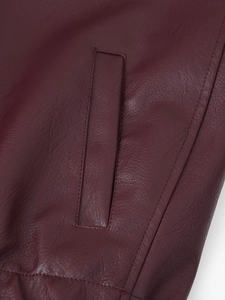 Detail of premium stitching and texture on a vintage faux leather motorcycle jacket