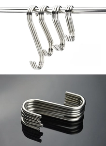 Detailed view of various sizes of heavy duty stainless steel S hooks hanging on a metal rod